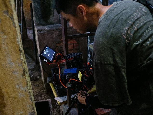 A technician performing careful plumbing camera inspection in Los Banos.