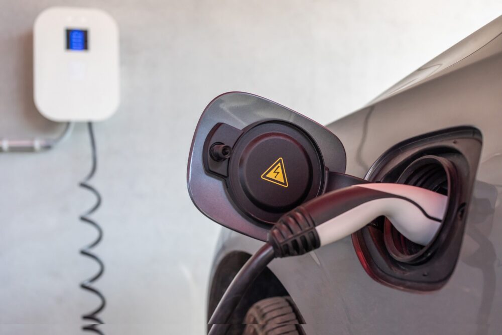 Car in garage plugged into EV charger
